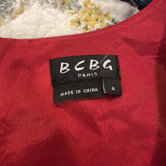 This is a gorgeous satin red dress. It’s a size 4. - Picture 2 of 4